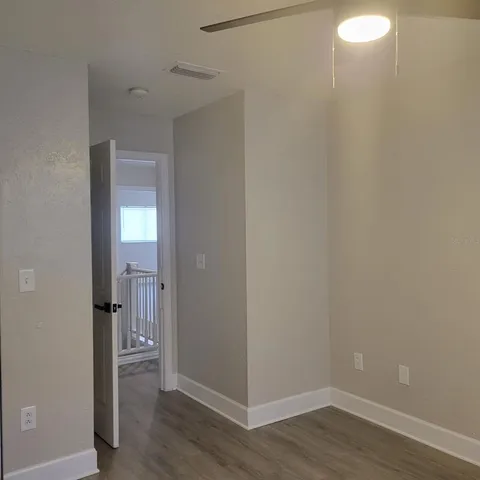 a bathroom with a granite countertop sink and mirror