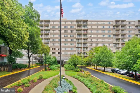 a front view of a building with garden
