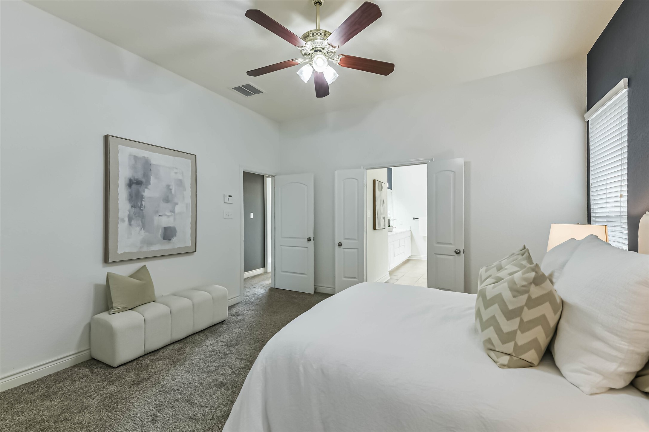 19022 Greenleaf Ridge Court Cypress, TX 77429 - Photo 24 of 47 a spacious bedroom with a bed and ceiling fan