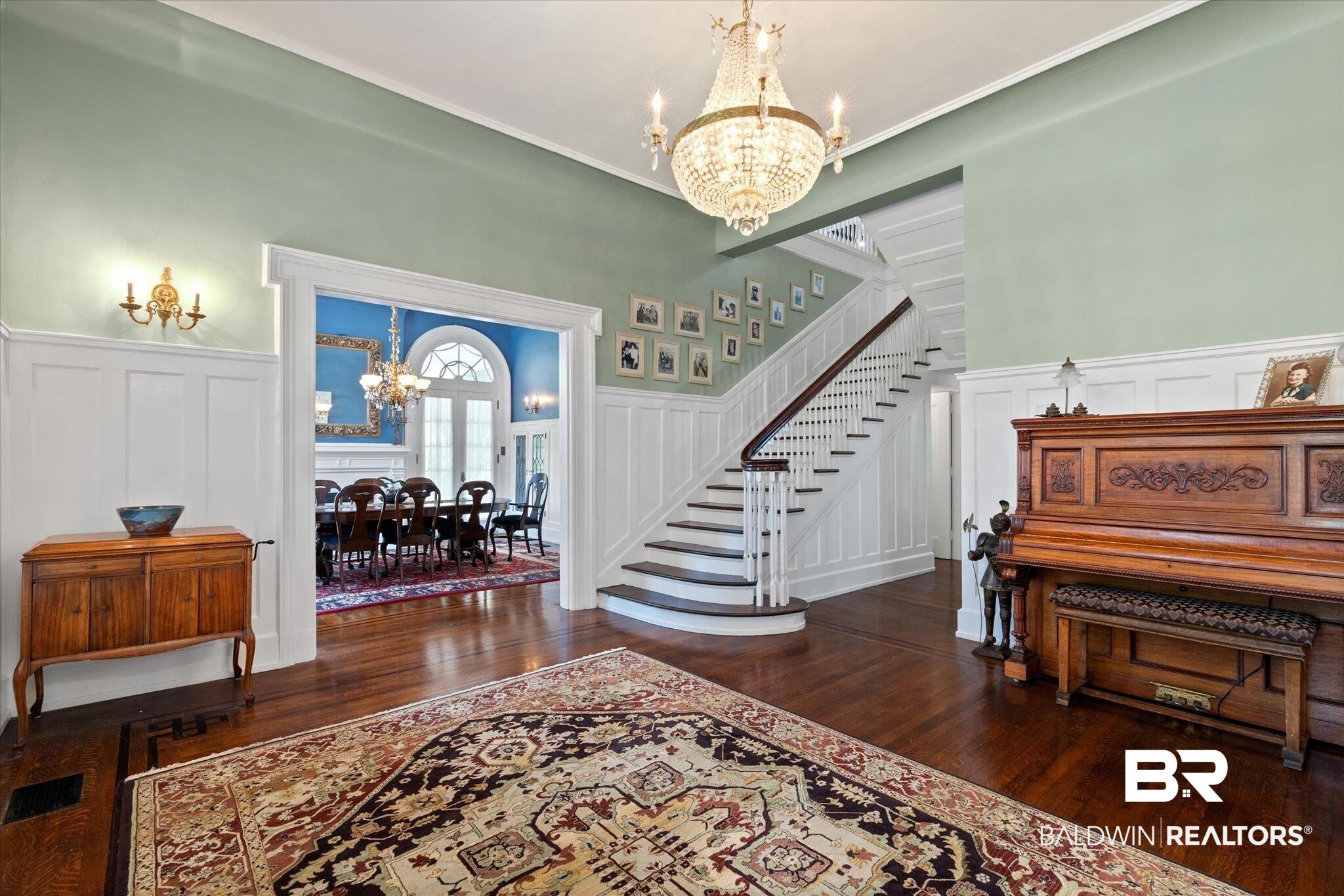 1953 Dauphin Street Mobile, AL 36606 - Photo 4 of 56 Entryway with dark hardwood / wood-style floors and an inviting chandelier