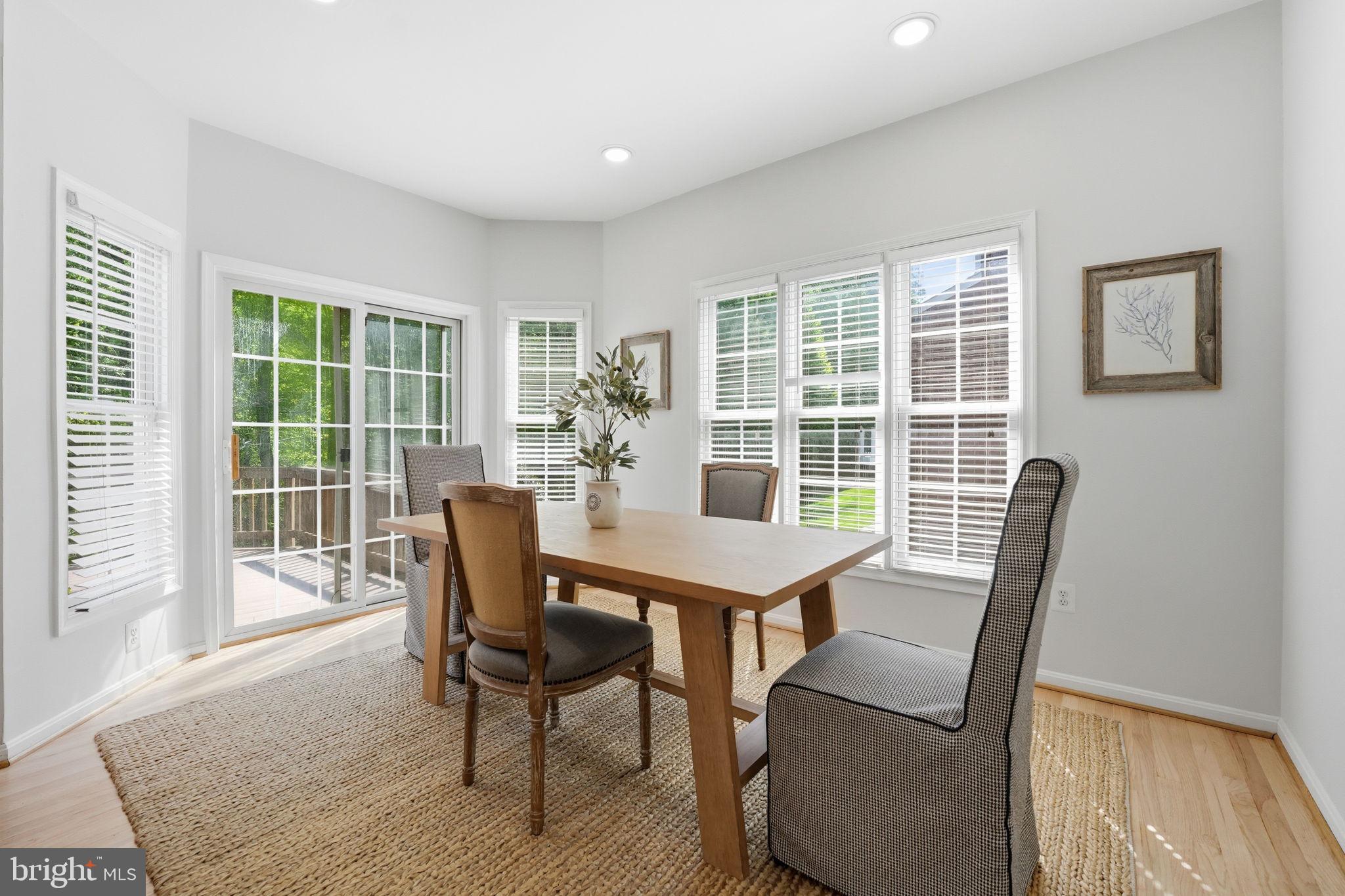 6075 Deer Ridge Trail Springfield, VA 22150 - Photo 16 of 61 a view of a dining room with furniture window and outside view