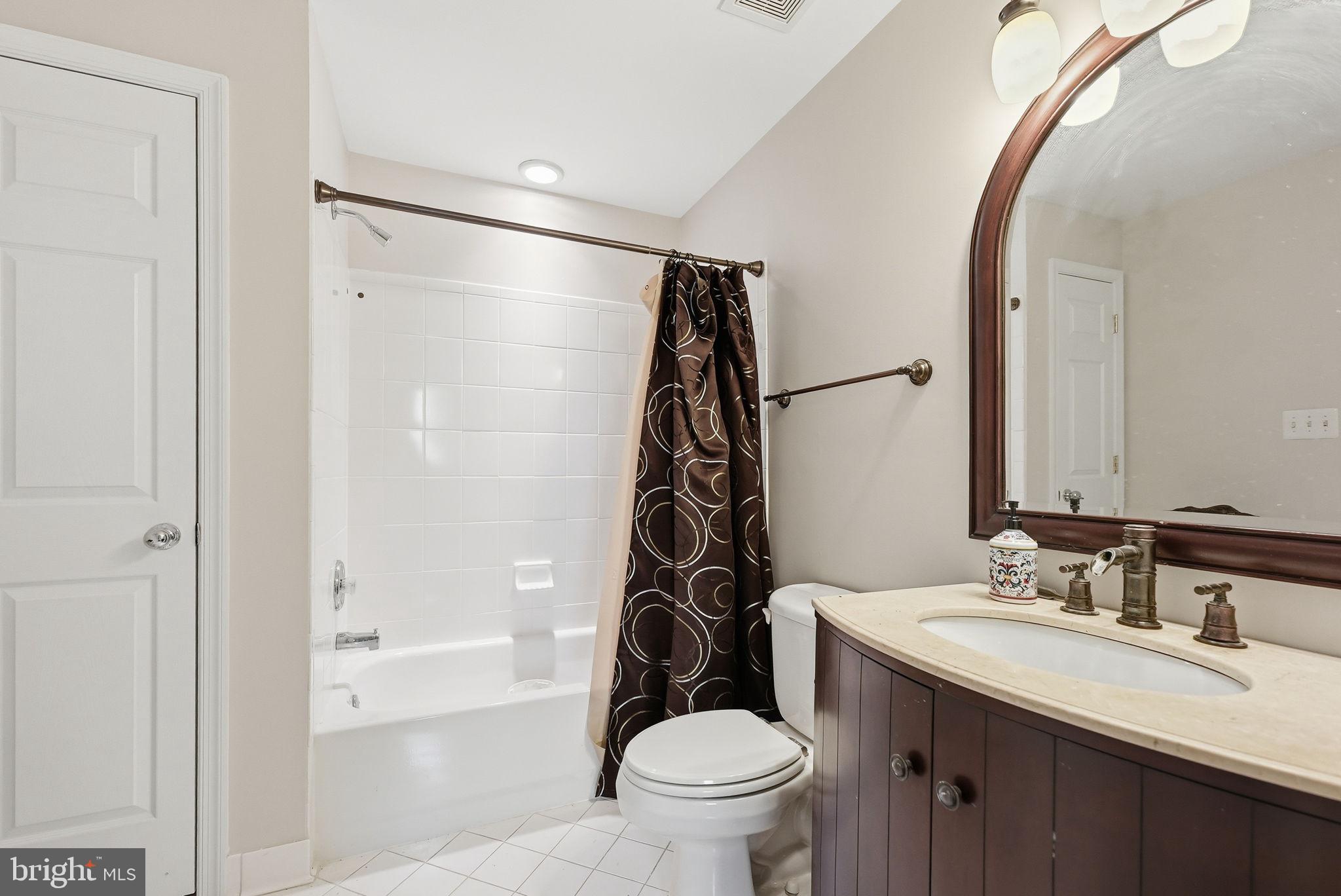 6075 Deer Ridge Trail Springfield, VA 22150 - Photo 28 of 61 a bathroom with a sink toilet and shower