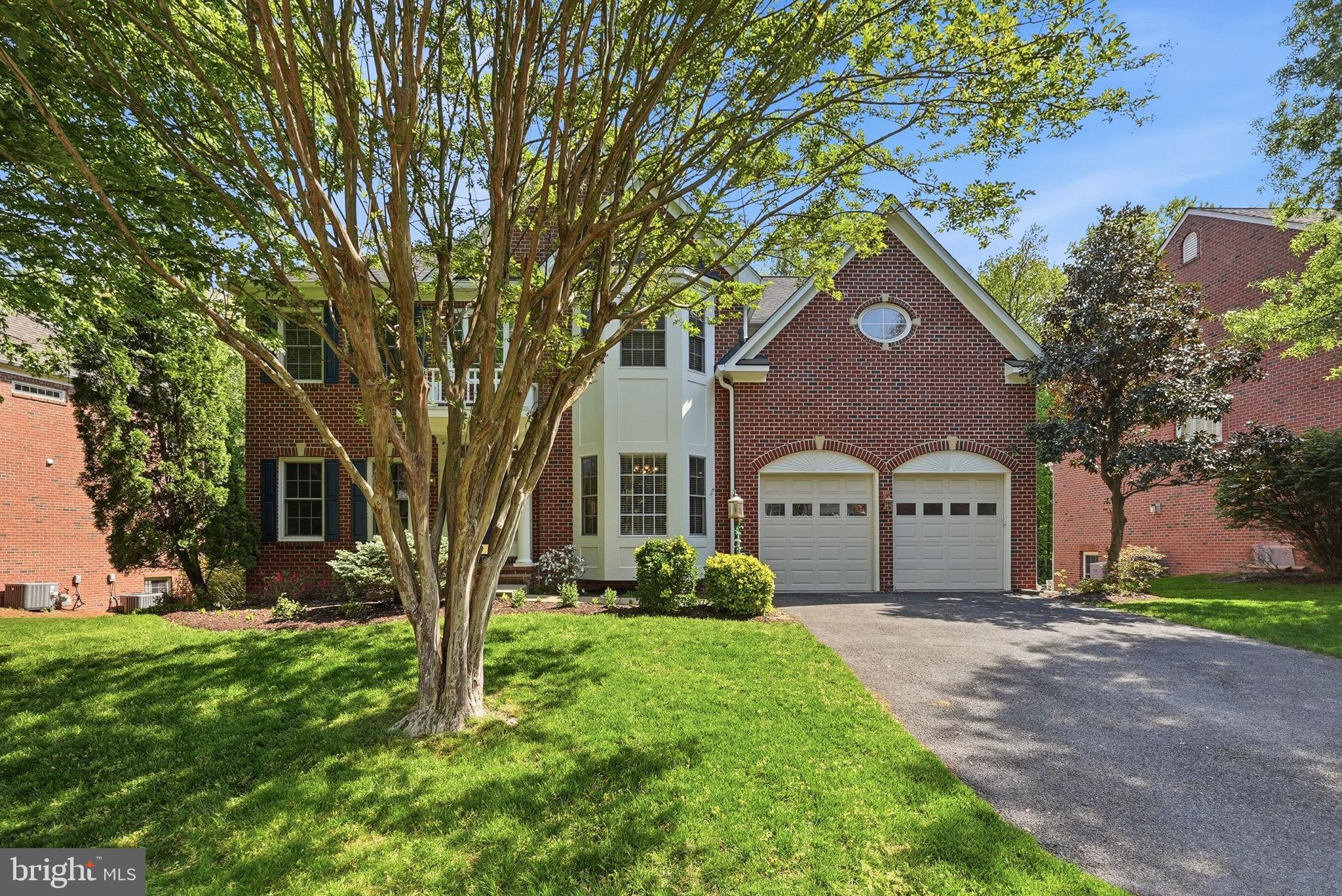 6075 Deer Ridge Trail Springfield, VA 22150 - Photo 3 of 61 a front view of a house with a yard