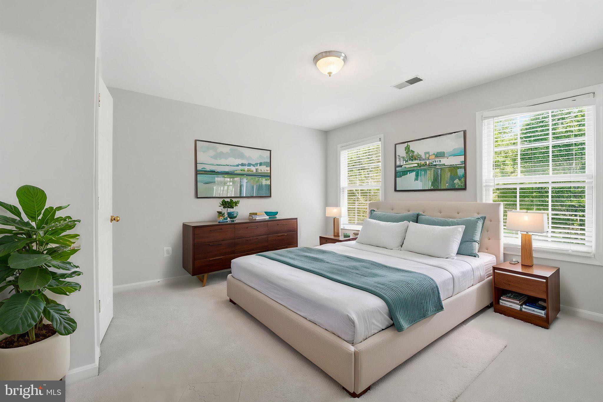 6075 Deer Ridge Trail Springfield, VA 22150 - Photo 47 of 61 a bedroom with a bed and a potted plant