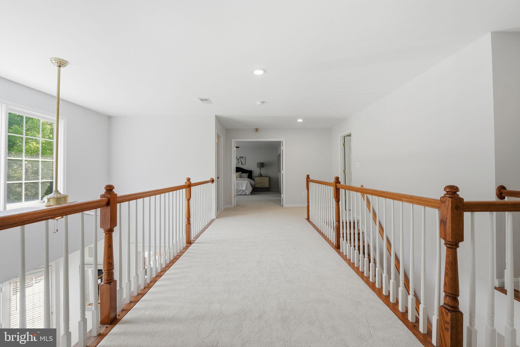 6075 Deer Ridge Trail Springfield, VA 22150 - Photo 50 of 61 a view of a hallway with window