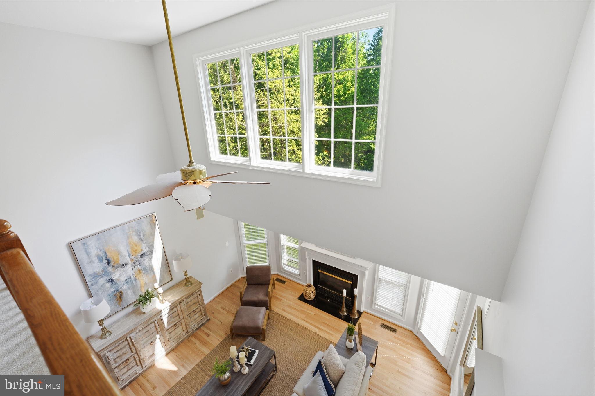 6075 Deer Ridge Trail Springfield, VA 22150 - Photo 52 of 61 a living room with furniture and a fireplace