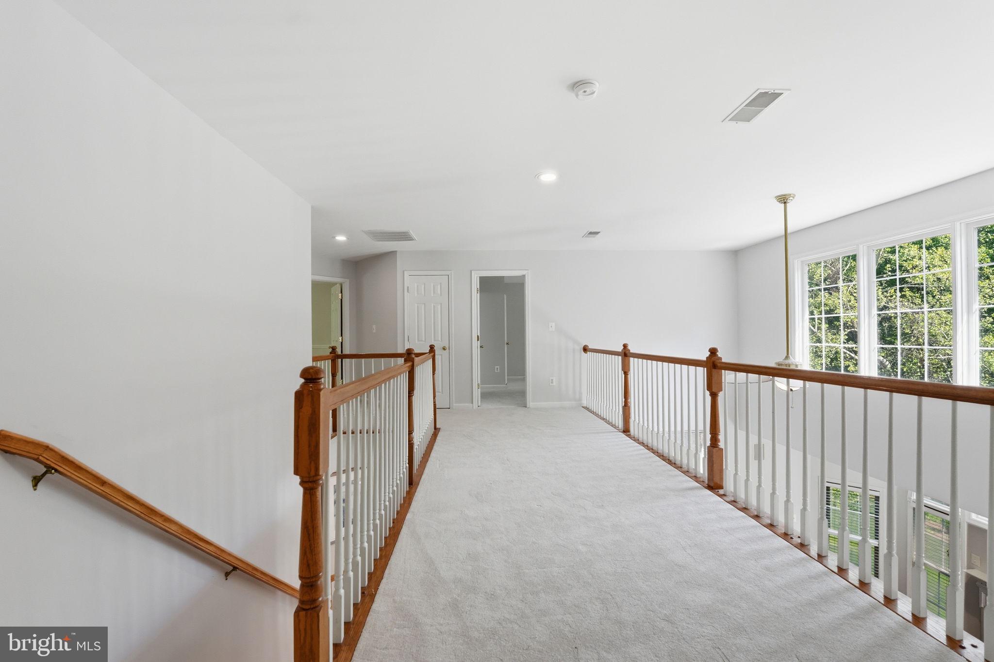 6075 Deer Ridge Trail Springfield, VA 22150 - Photo 53 of 61 a view of a hallway with window
