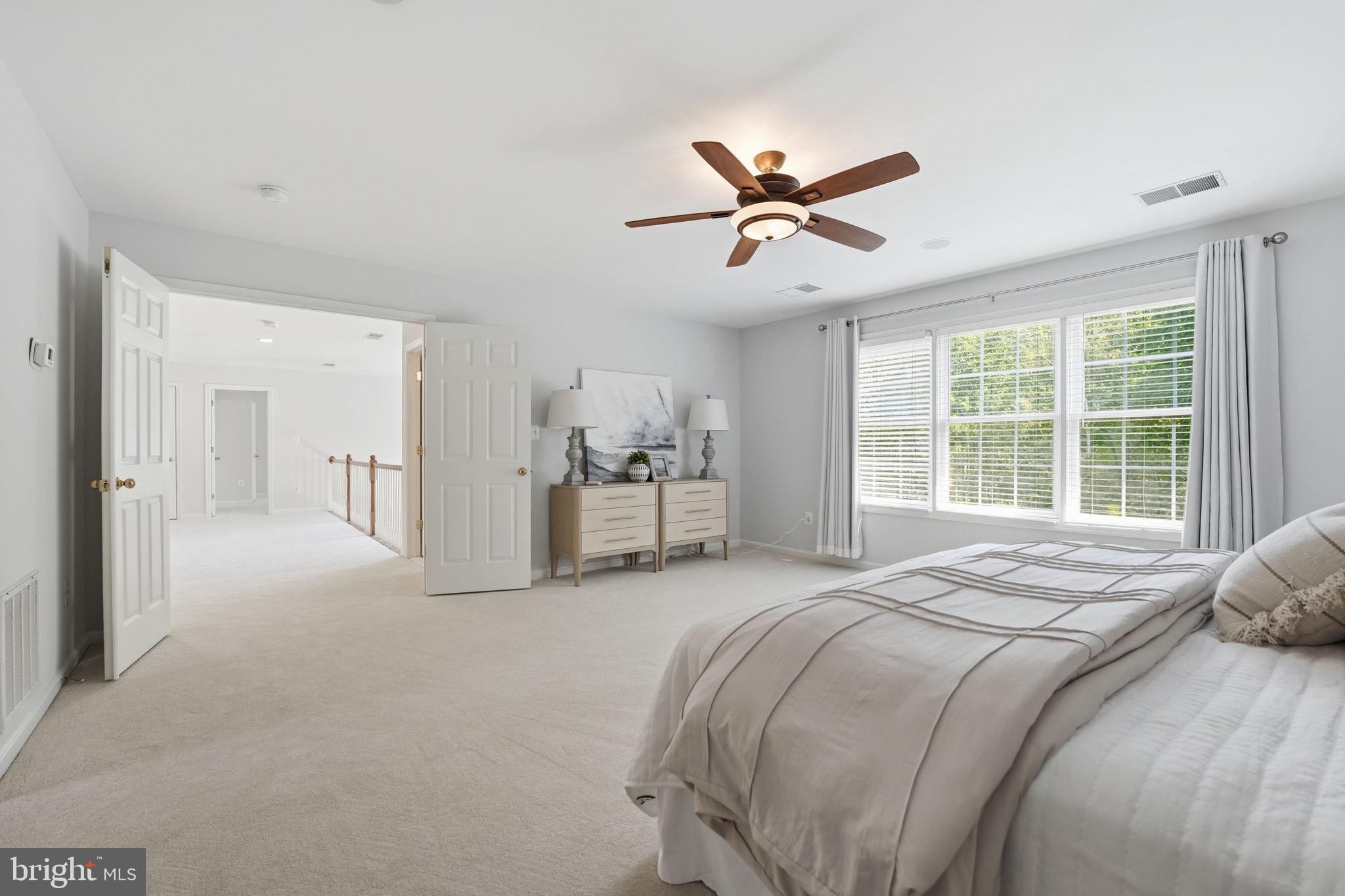 6075 Deer Ridge Trail Springfield, VA 22150 - Photo 56 of 61 a view of a bedroom with a bed and window