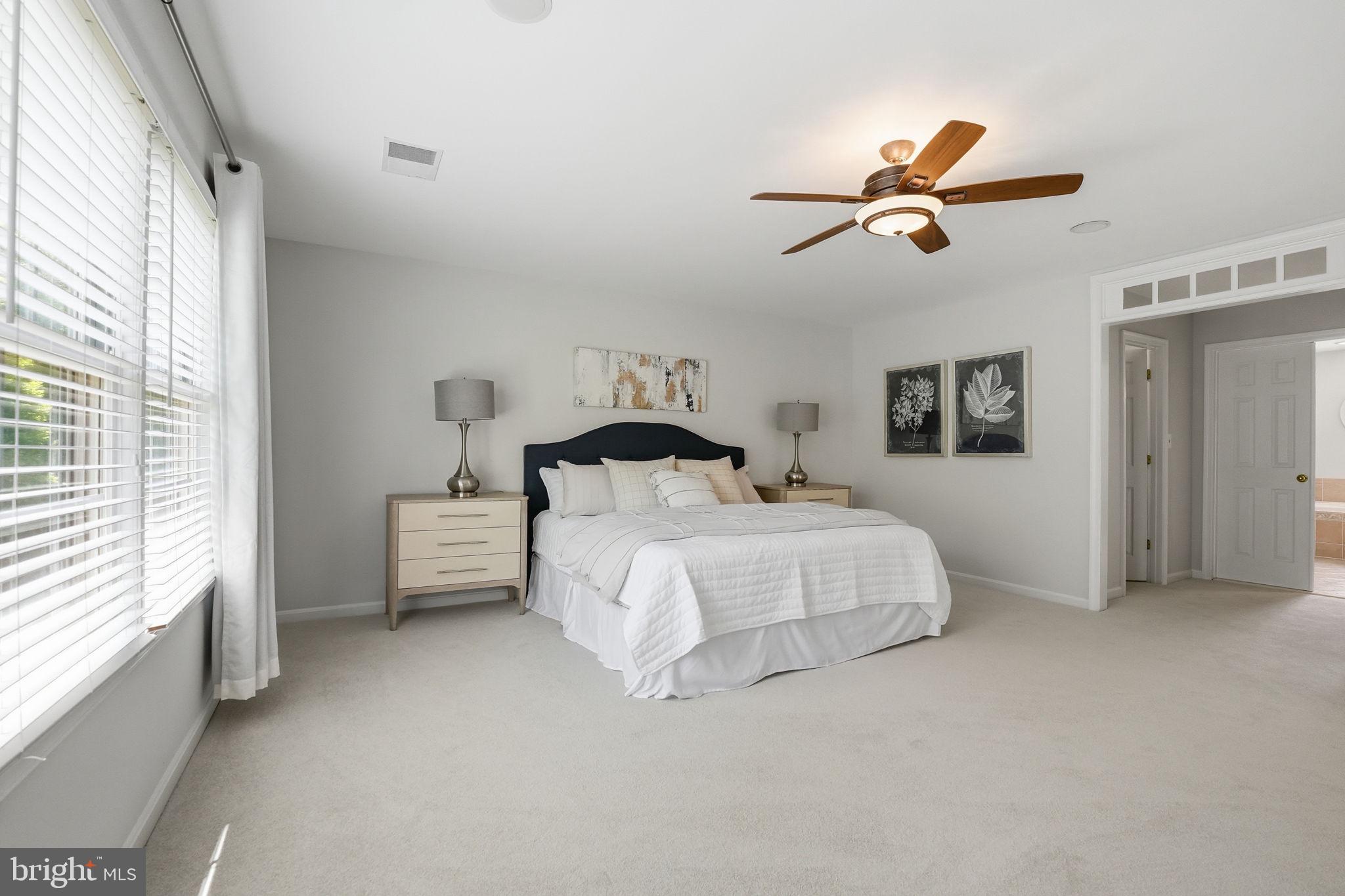 6075 Deer Ridge Trail Springfield, VA 22150 - Photo 57 of 61 a bedroom with a bed and a window