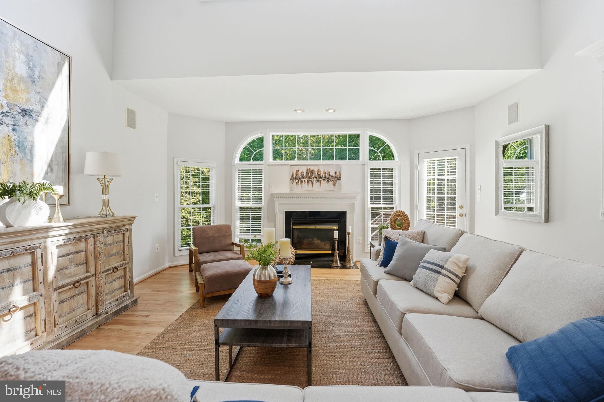 6075 Deer Ridge Trail Springfield, VA 22150 - Photo 7 of 61 a living room with furniture fireplace and a large window