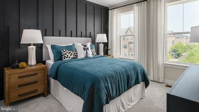 a bed room with a bed and a window