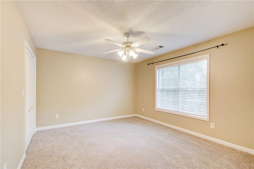837 Ravins Way Stockbridge, GA 30281 - Photo 22 of 32 a view of an empty room with a window