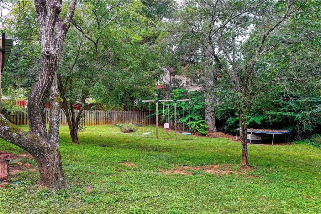 837 Ravins Way Stockbridge, GA 30281 - Photo 27 of 32 a green field with lots of trees