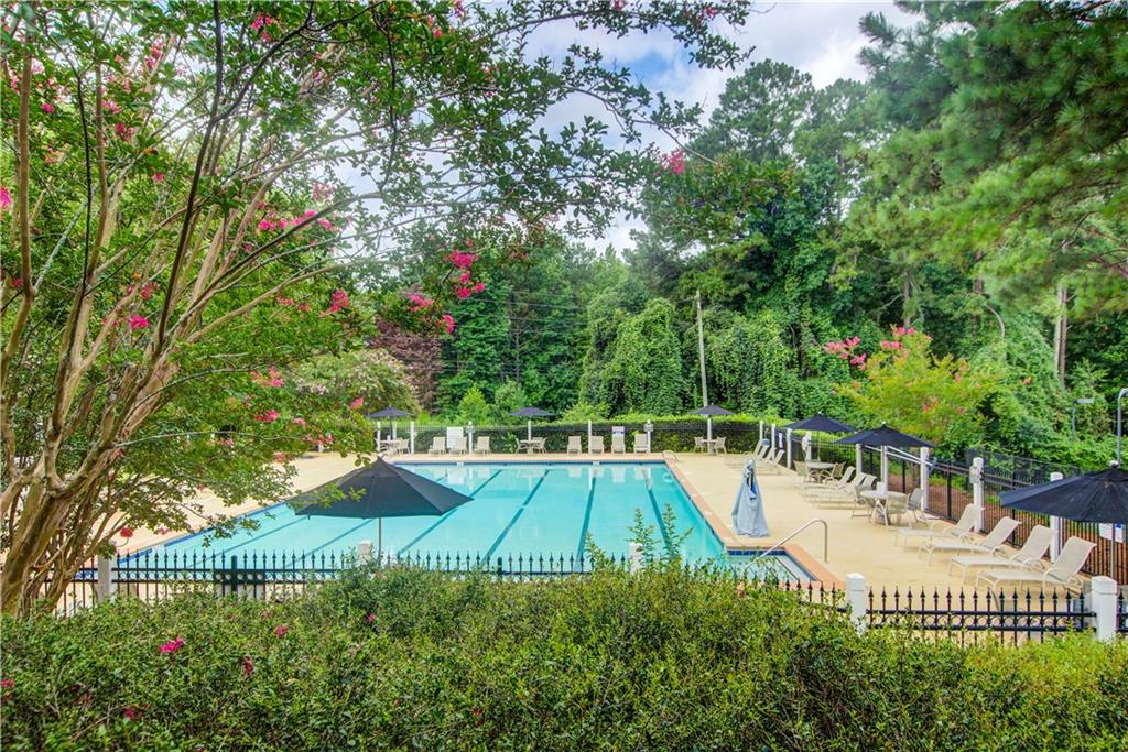 837 Ravins Way Stockbridge, GA 30281 - Photo 30 of 32 a view of a swimming pool with a patio and plants