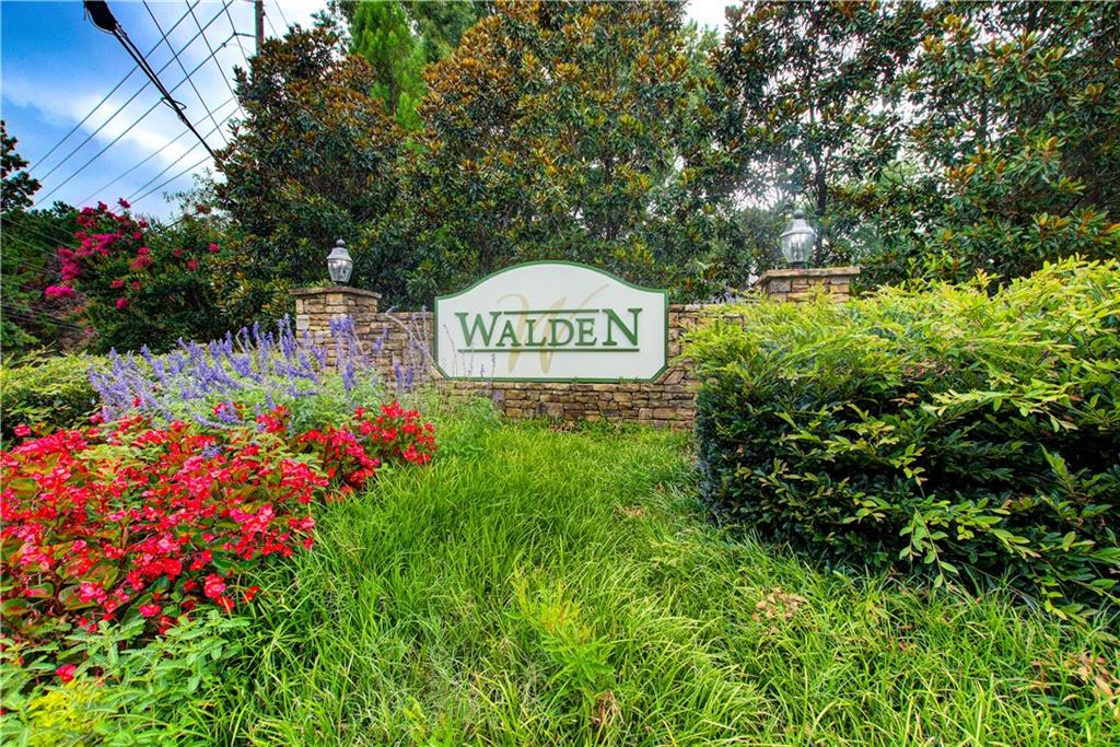 837 Ravins Way Stockbridge, GA 30281 - Photo 32 of 32 a sign that is sitting in front of flowers
