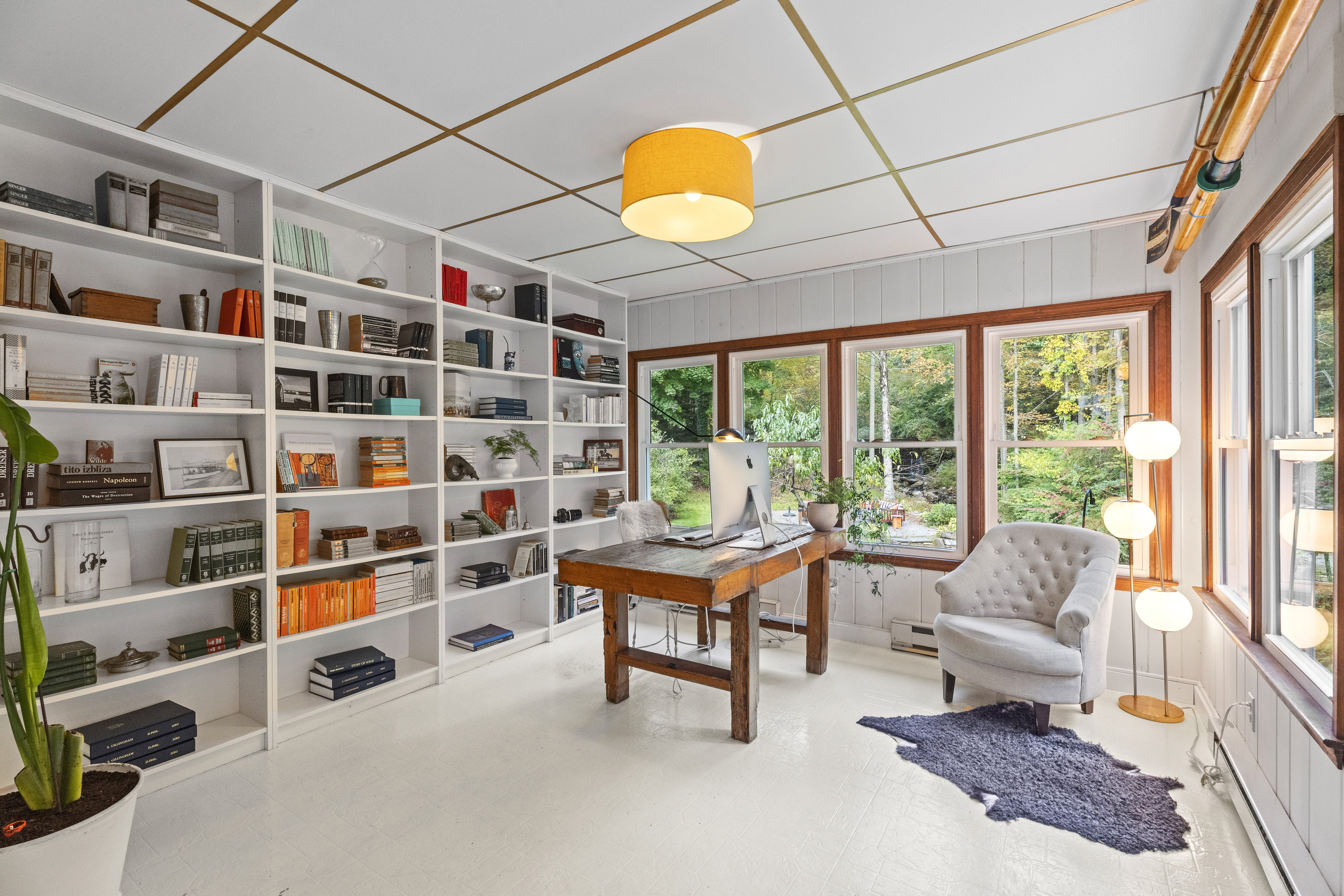 58 Middle Haddam Road East Hampton, CT 06456 - Photo 19 of 40 a living room with furniture cabinets and a large window