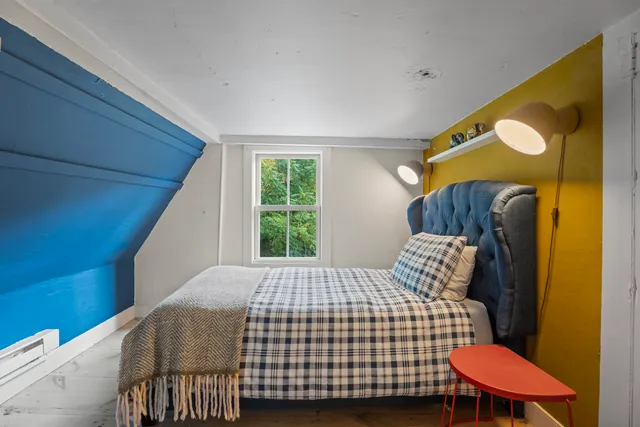 a bathroom with a sink a bathtub and a window