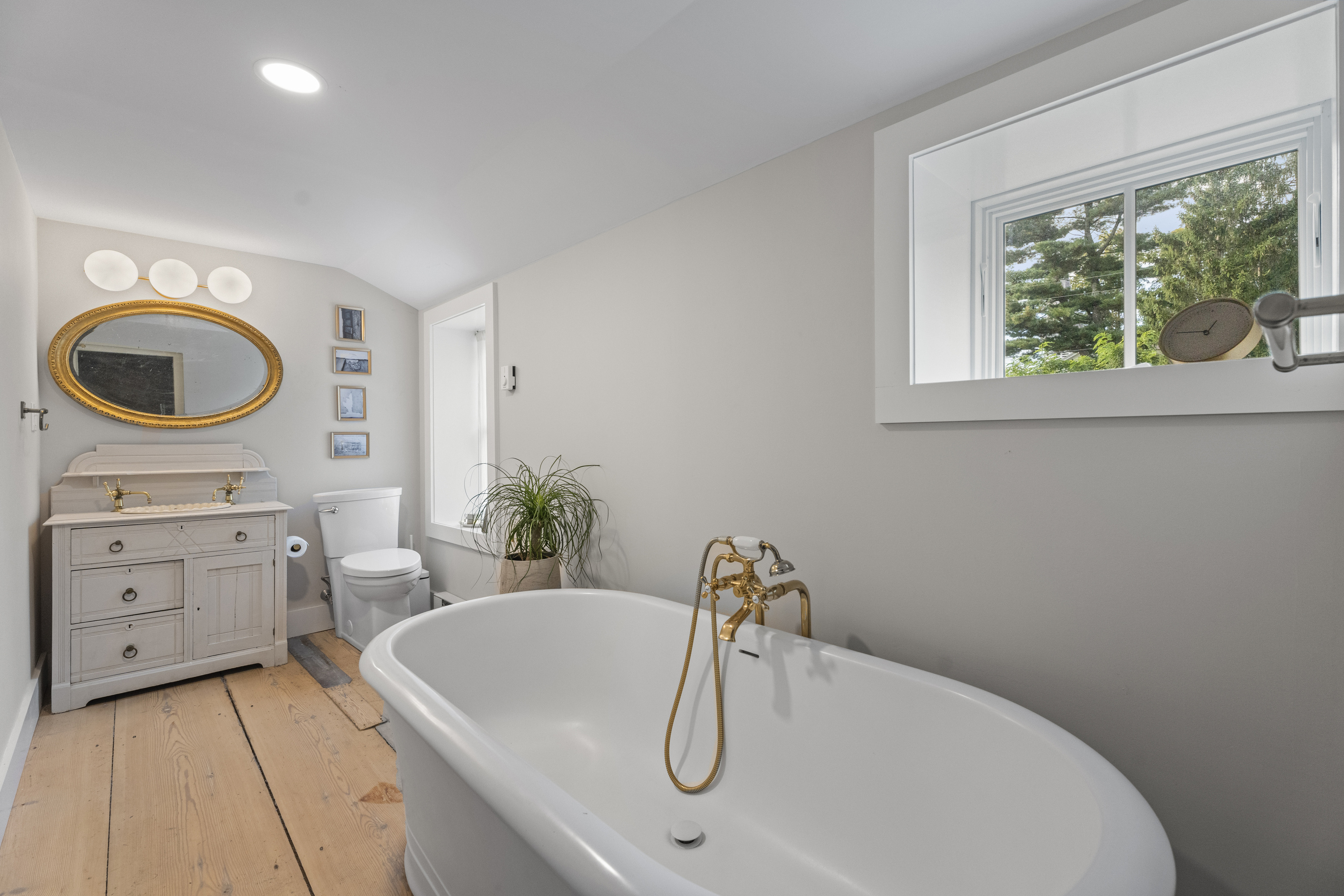 58 Middle Haddam Road East Hampton, CT 06456 - Photo 28 of 40 a bathroom with a sink a bathtub and a window