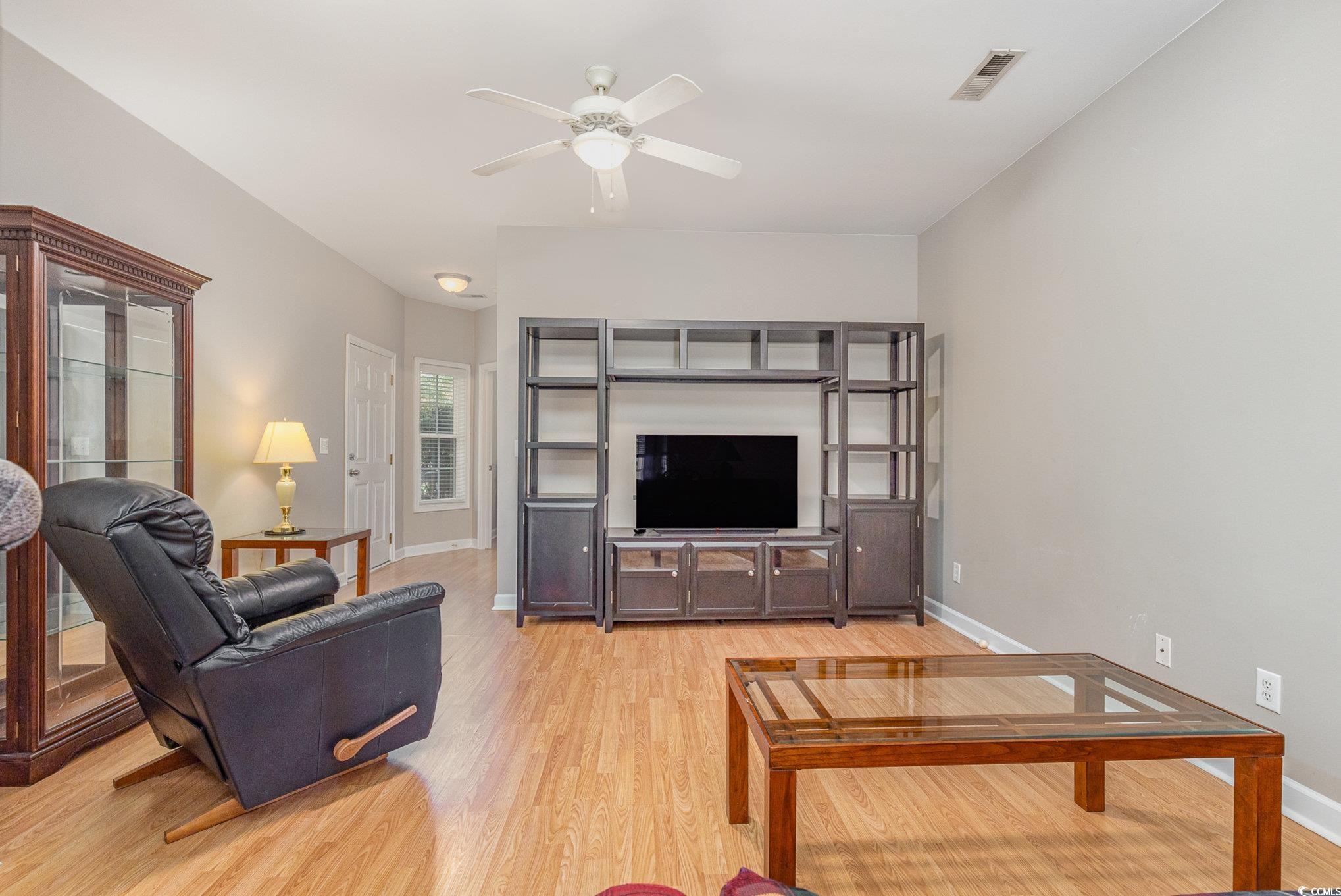 2740 Bayboro Street Loris, SC 29569 - Photo 8 of 40 Living room with ceiling fan and light hardwood /