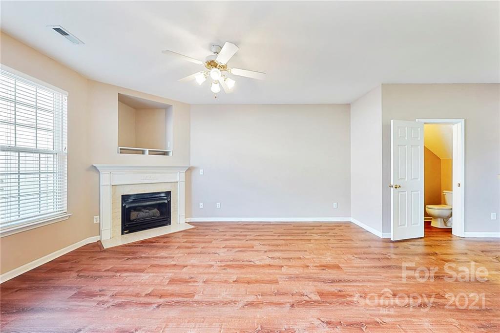 924 Azurine Circle Fort Mill, SC 29708 - Photo 11 of 41 a view of an empty room with window and wooden floor