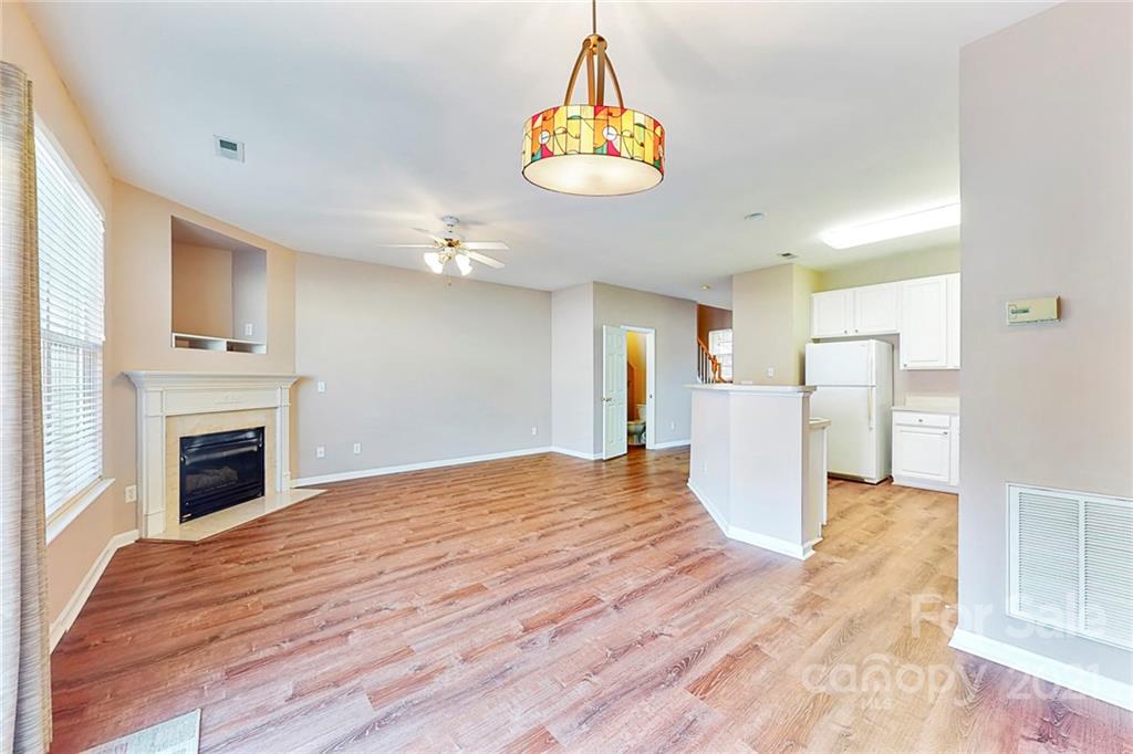 924 Azurine Circle Fort Mill, SC 29708 - Photo 12 of 41 a view of empty room with wooden floor and fireplace