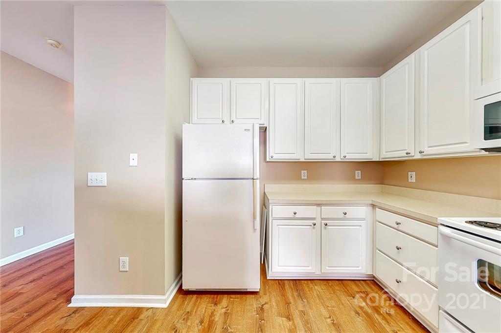 924 Azurine Circle Fort Mill, SC 29708 - Photo 15 of 41 a kitchen with white cabinets and white appliances