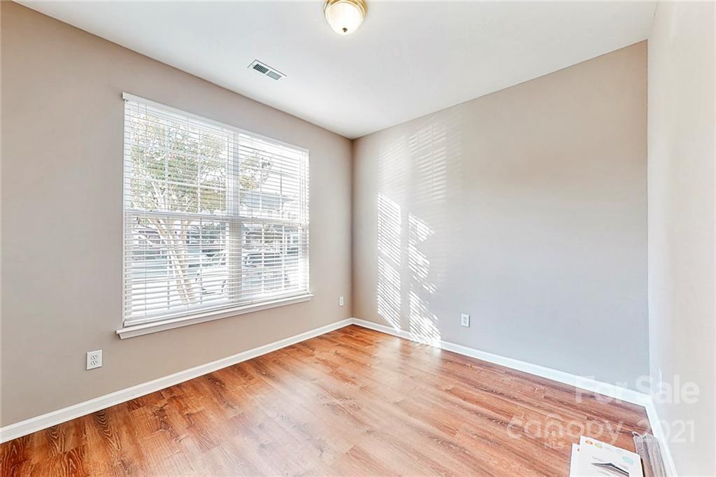 924 Azurine Circle Fort Mill, SC 29708 - Photo 18 of 41 a view of an empty room with wooden floor and a window