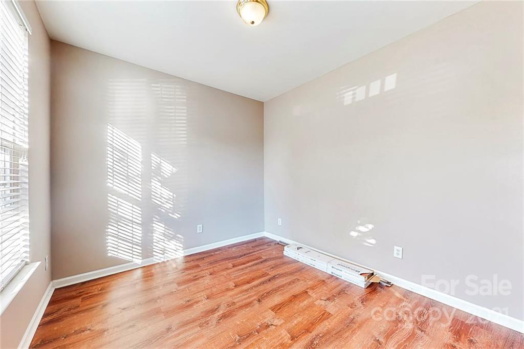 924 Azurine Circle Fort Mill, SC 29708 - Photo 19 of 41 a view of empty room with wooden floor and fan
