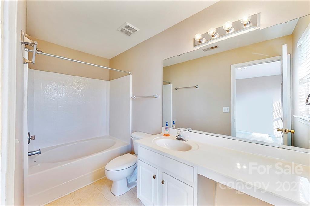 924 Azurine Circle Fort Mill, SC 29708 - Photo 21 of 41 a bathroom with a bathtub shower sink vanity and toilet