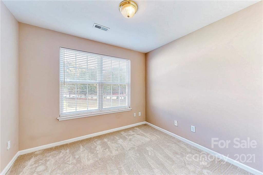 924 Azurine Circle Fort Mill, SC 29708 - Photo 30 of 41 a view of an empty room with a window and a fan