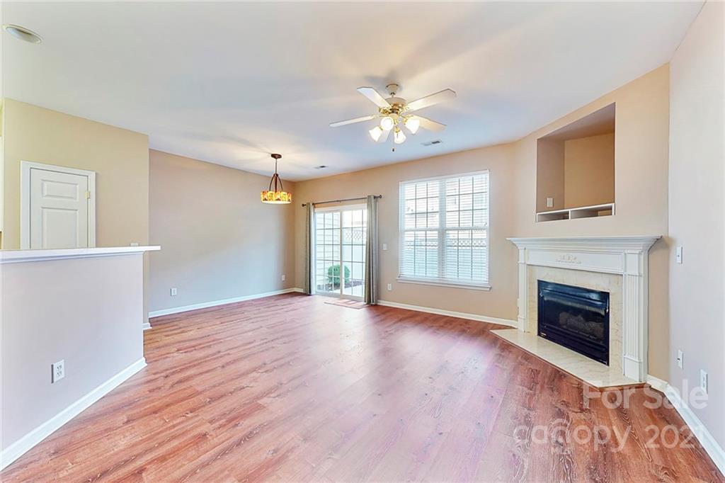 924 Azurine Circle Fort Mill, SC 29708 - Photo 8 of 41 a view of an empty room with window and wooden floor