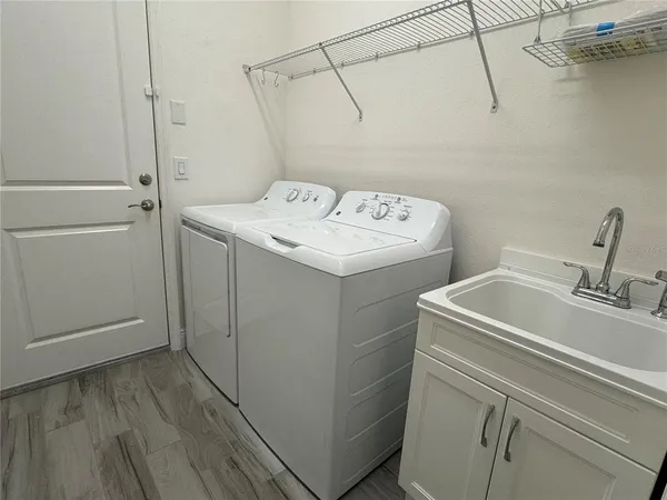 a utility room with dryer and washer