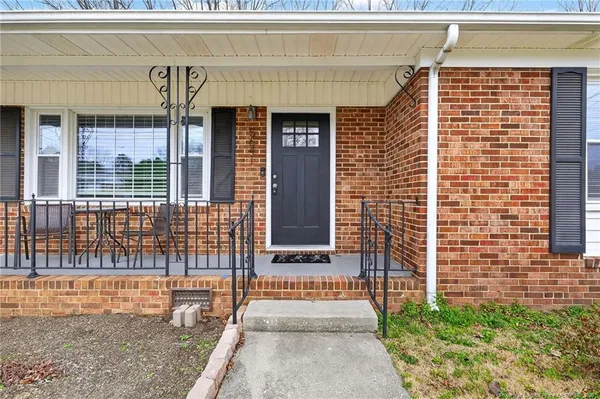 a front view of a house with a outdoor seating