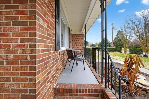a balcony with view of outdoor space
