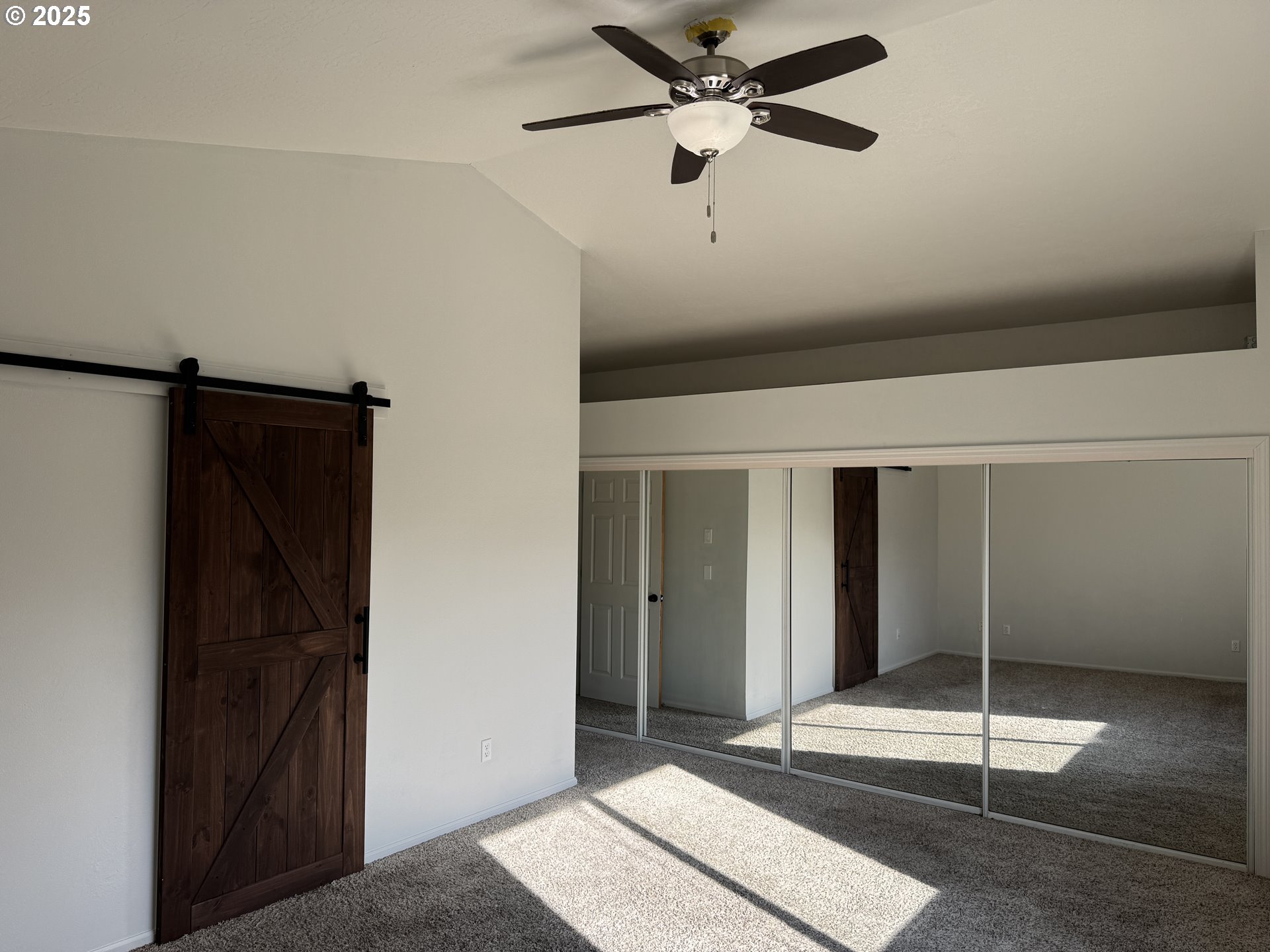 4015 Scenic Drive, Unit 4027 Eugene, OR 97404 - Photo 11 of 26 a view of a hallway with wooden floor and windows