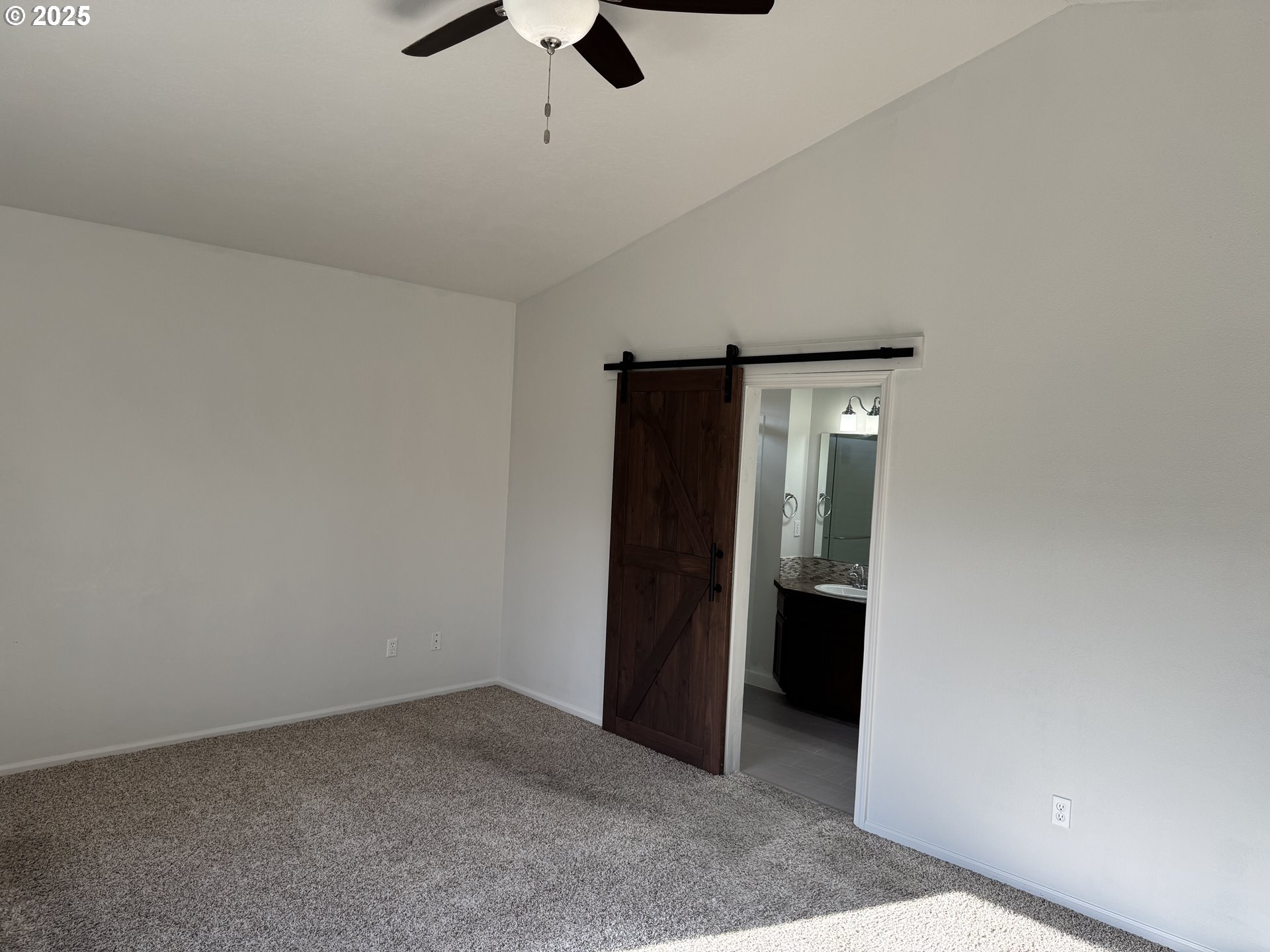 4015 Scenic Drive, Unit 4027 Eugene, OR 97404 - Photo 12 of 26 an empty room with closet and a ceiling fan