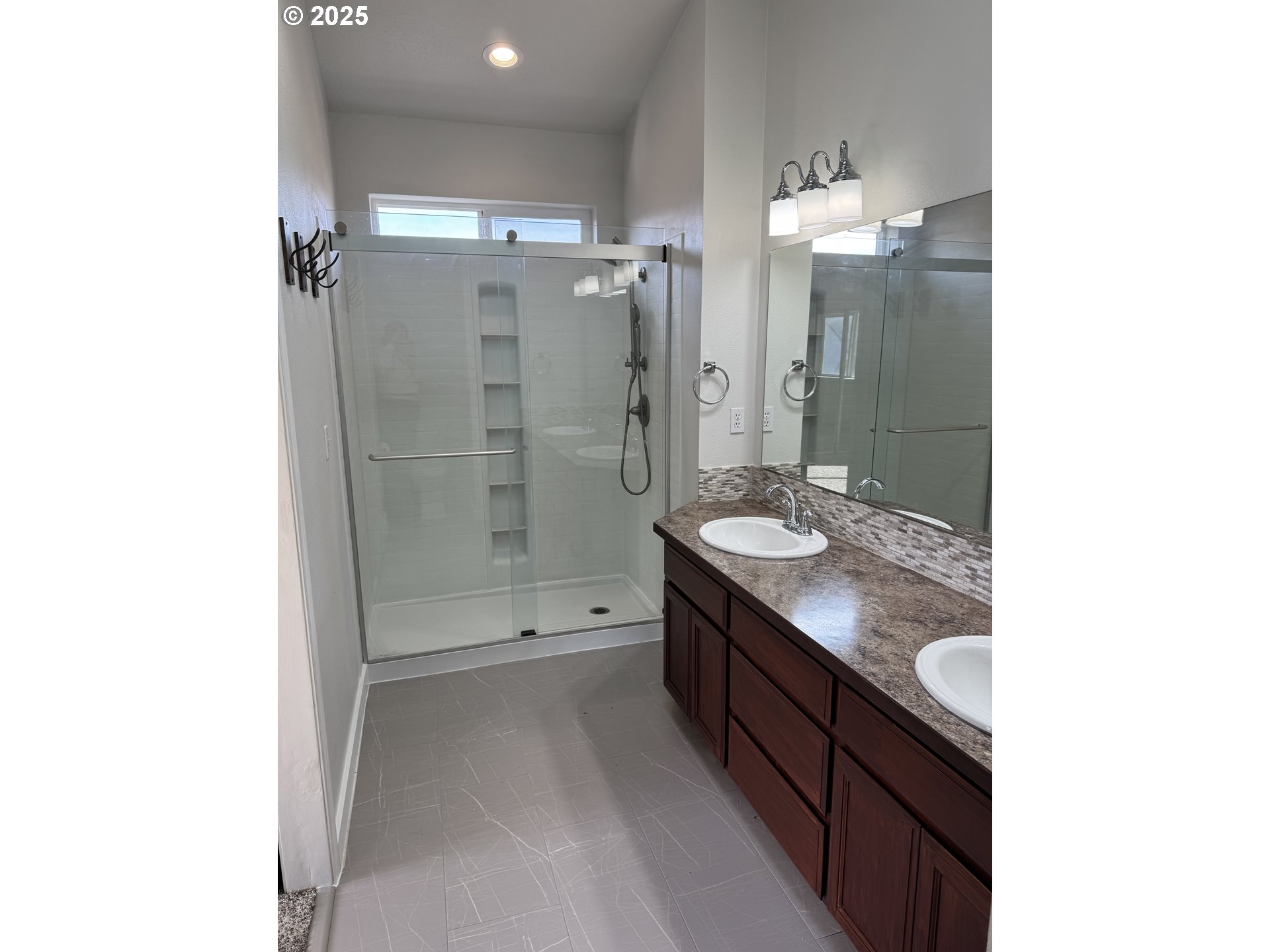 4015 Scenic Drive, Unit 4027 Eugene, OR 97404 - Photo 14 of 26 a bathroom with a granite countertop sink a shower and a mirror