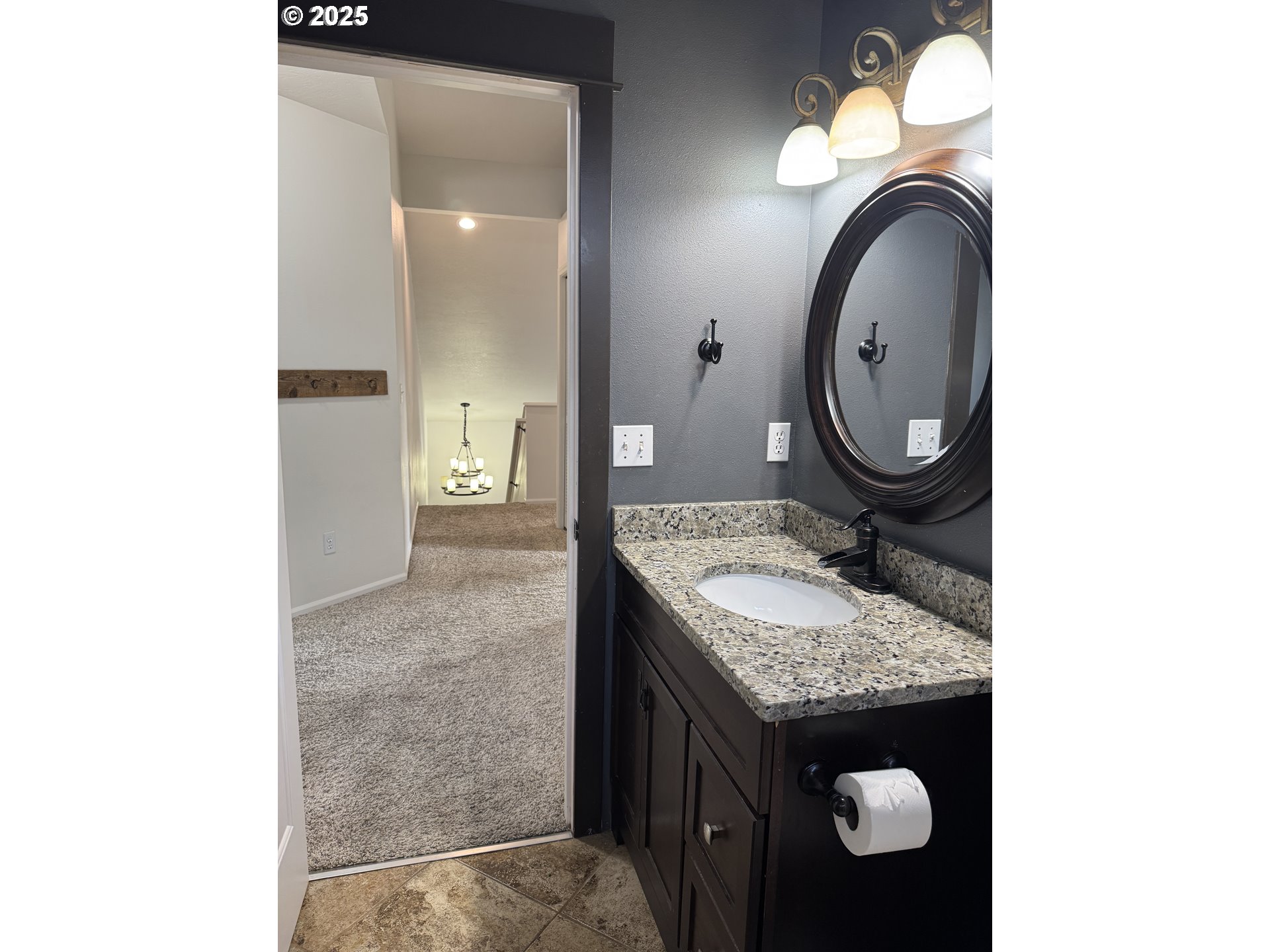 4015 Scenic Drive, Unit 4027 Eugene, OR 97404 - Photo 20 of 26 a bathroom with a granite countertop sink and a mirror
