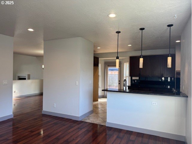 4015 Scenic Drive, Unit 4027 Eugene, OR 97404 - Photo 9 of 26 a view of a room with wooden floor and a cabinet