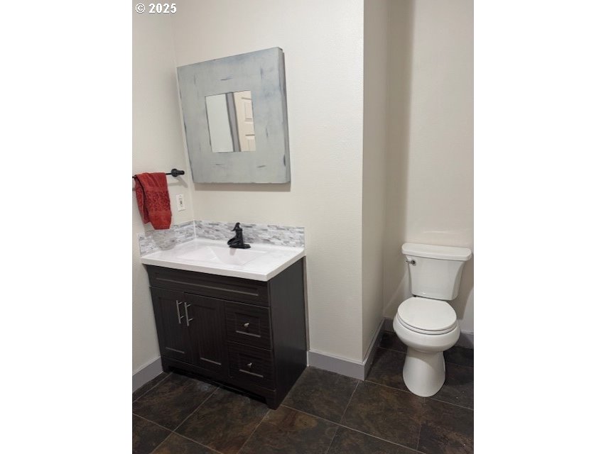 4015 Scenic Drive, Unit 4027 Eugene, OR 97404 - Photo 10 of 26 a bathroom with a sink and a mirror