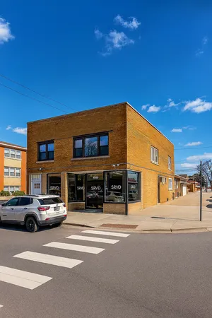 a view of a building with a street