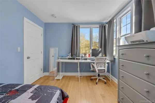 a room with a bed and a desk