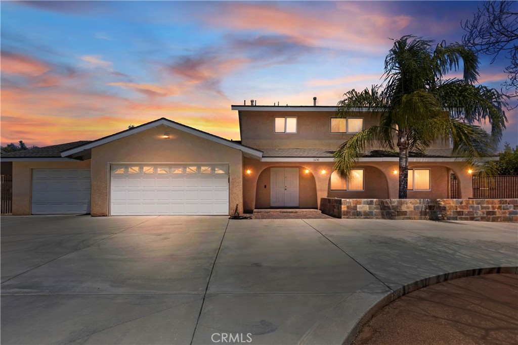 16940 Tava Lane Riverside, CA 92504 - Photo 1 of 1 a front view of a house with a yard and garage