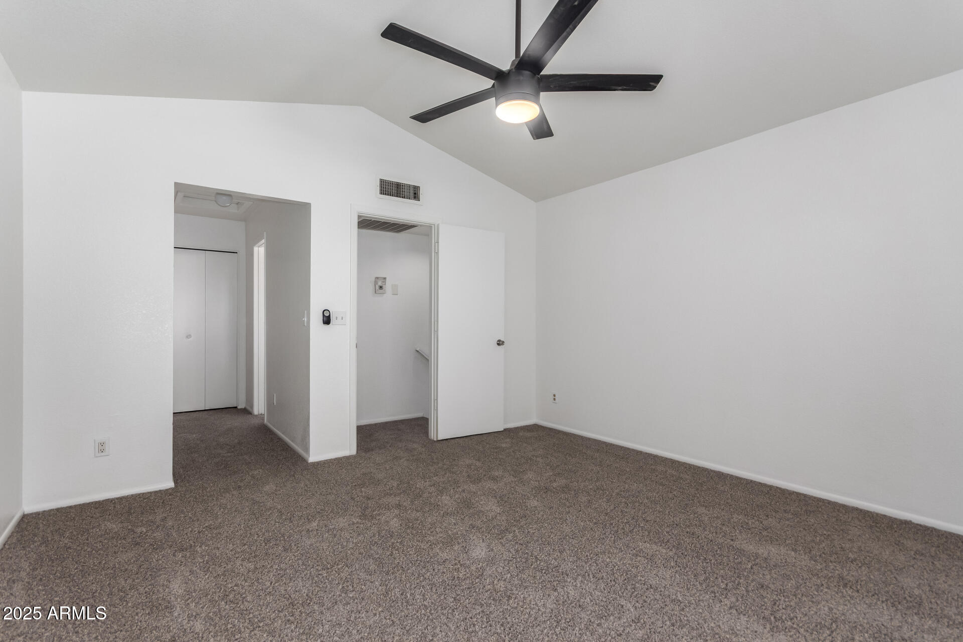 4162 East Wayland Road Phoenix, AZ 85040 - Photo 11 of 36 an empty room with closet and fan