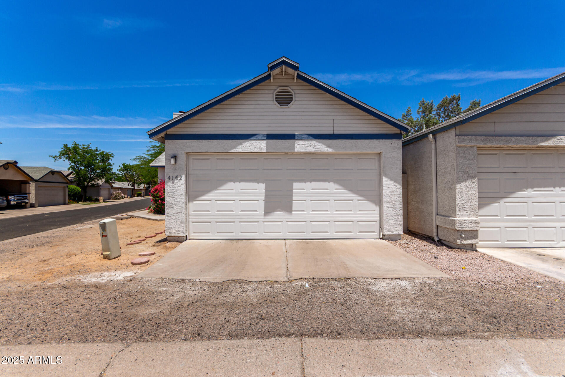4162 East Wayland Road Phoenix, AZ 85040 - Photo 26 of 36 a front view of a house with a yard