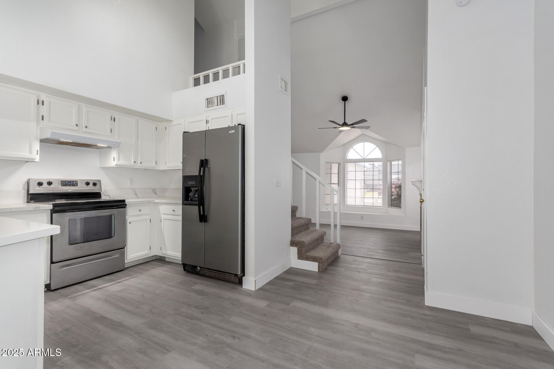 4162 East Wayland Road Phoenix, AZ 85040 - Photo 6 of 36 a kitchen with granite countertop a refrigerator stove and sink