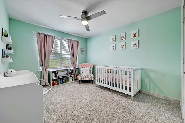 a bedroom with furniture and a window