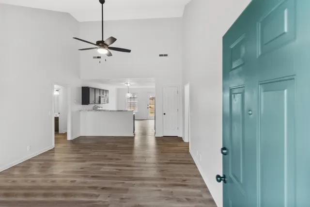 a view of a kitchen from the hallway