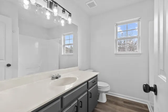 an empty room with a ceiling fan