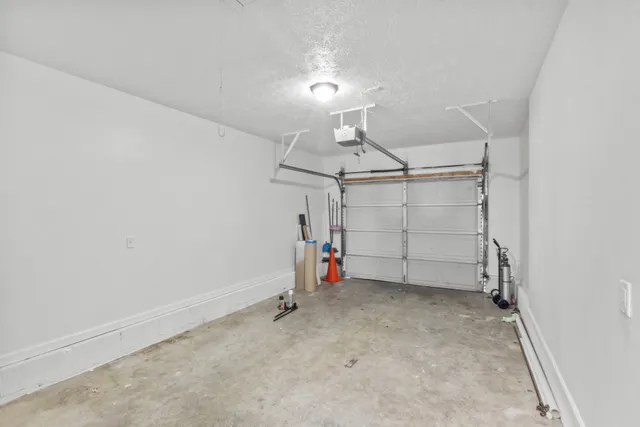 a front view of a house with garage